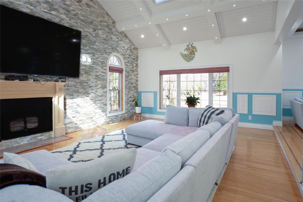 Fireplace, Interior, Living room, Recessed Lighting, Stone Walls, Wood Texture Flooring