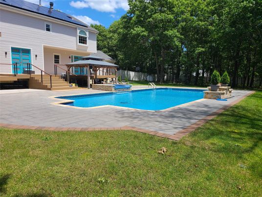 Exterior, Pool, Solar Panels