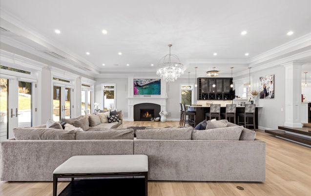 Chandelier, Fireplace, Interior, Living room, Pendant Lights, Recessed Lighting, Wood Texture Flooring