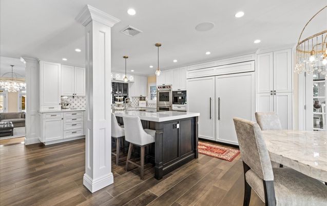 Chandelier, Dining room, Interior, Kitchen, Pendant Lights, Recessed Lighting, Stainless Steel Appliances, Wood Texture Flooring