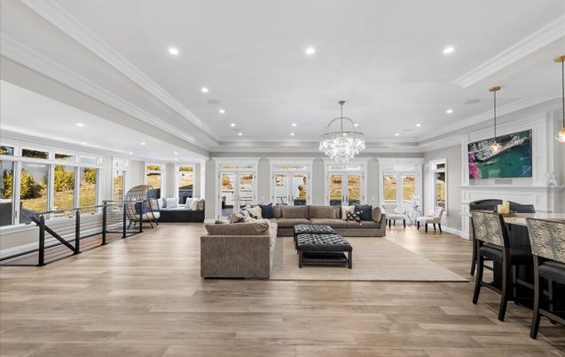 Chandelier, Fireplace, Interior, Living room, Pendant Lights, Recessed Lighting, Wood Texture Flooring