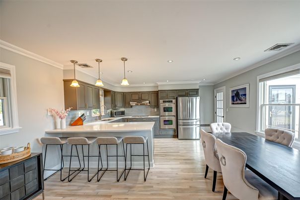 Dining room, Interior, Kitchen, Pendant Lights, Recessed Lighting, Stainless Steel Appliances, Wood Texture Flooring