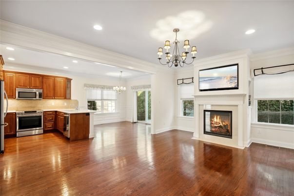 Chandelier, Empty room, Fireplace, Interior, Kitchen, Recessed Lighting, Wood Texture Flooring