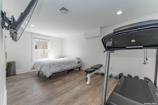 Bedroom, Fitness Equipment, Interior, Recessed Lighting, Wood Texture Flooring