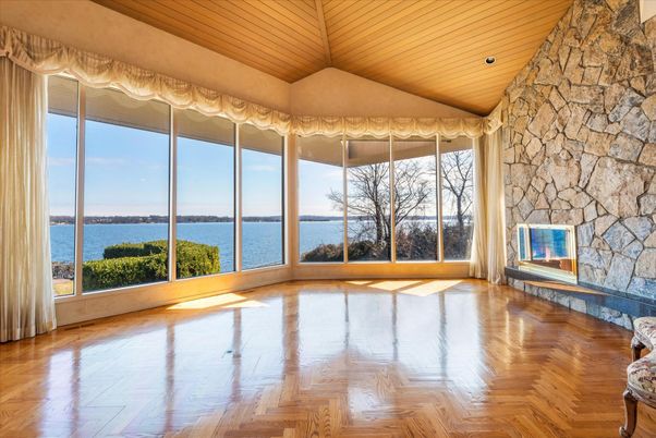 Empty room, Fireplace, Interior, Recessed Lighting, Stone Walls, Water, Wooden Ceilings, Wood Texture Flooring