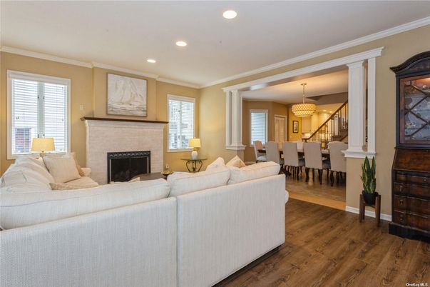 Chandelier, Dining room, Fireplace, Interior, Living room, Recessed Lighting, Wood Texture Flooring