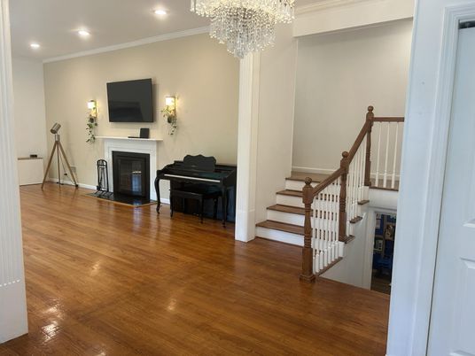 Chandelier, Fireplace, Interior, Piano, Recessed Lighting, Wood Texture Flooring