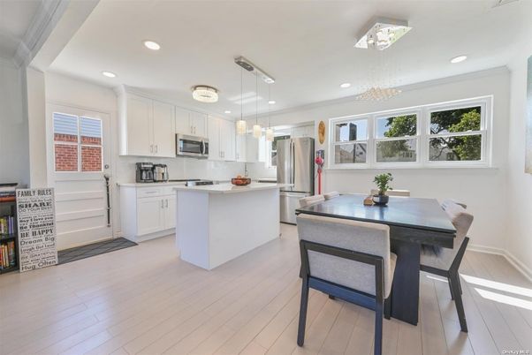 Chandelier, Dining room, Interior, Kitchen, Pendant Lights, Recessed Lighting, Stainless Steel Appliances, Wood Texture Flooring