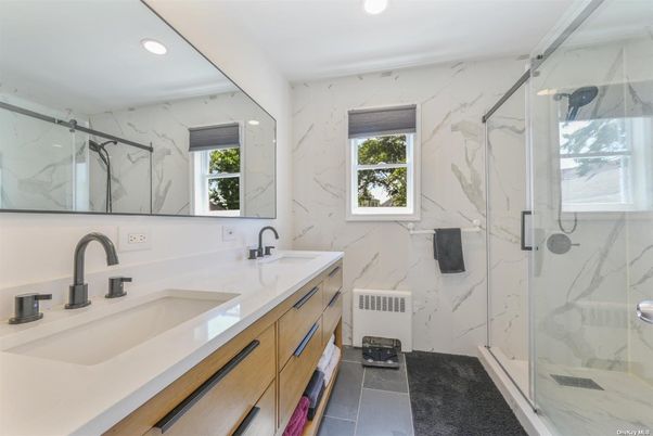 Bathroom, Dual Sink Vanities, Glass Shower, Interior, Marble Walls, Recessed Lighting