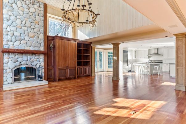 Chandelier, Fireplace, Interior, Kitchen, Pendant Lights, Recessed Lighting, Stone Walls, Wood Texture Flooring