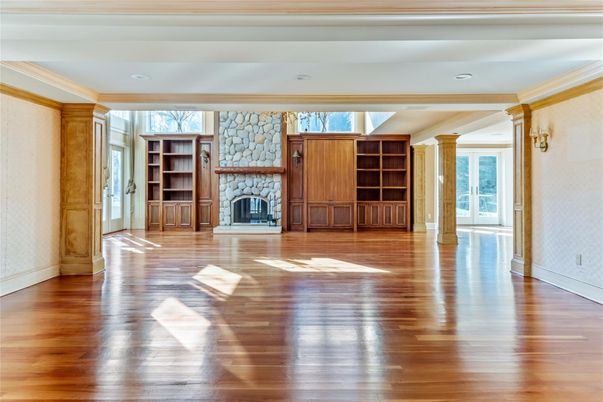 Empty room, Fireplace, Interior, Recessed Lighting, Stone Walls, Wood Texture Flooring
