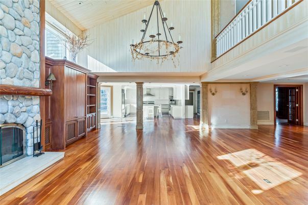 Chandelier, Empty room, Fireplace, Interior, Stone Walls, Wood Texture Flooring