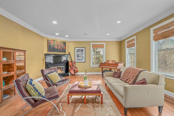 Fireplace, Interior, Living room, Piano, Recessed Lighting, Wood Texture Flooring