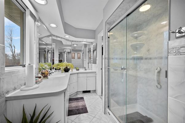 Bathroom, Dual Sink Vanities, Glass Shower, Interior, Marble, Marble Walls, Recessed Lighting