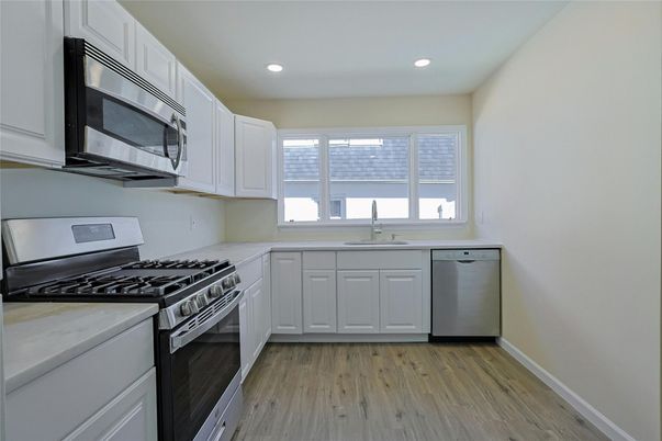 Interior, Kitchen, Recessed Lighting, Stainless Steel Appliances, Wood Texture Flooring