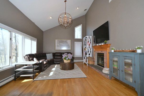 Chandelier, Fireplace, Interior, Living room, Recessed Lighting, Wood Texture Flooring
