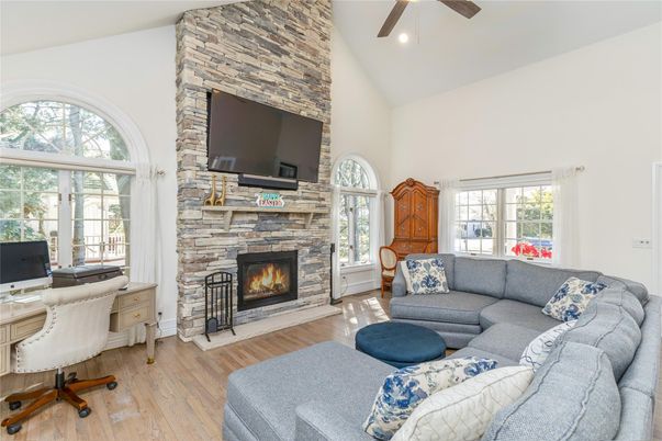 Fireplace, Home Office, Interior, Living room, Recessed Lighting, Stone Walls, Wood Texture Flooring
