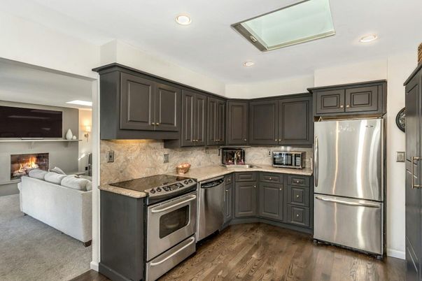 Fireplace, Interior, Kitchen, Living room, Recessed Lighting, Stainless Steel Appliances, Wood Texture Flooring