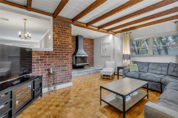 Chandelier, Fireplace, Interior, Living room, Stone Walls, Wooden Beams, Wood Texture Flooring