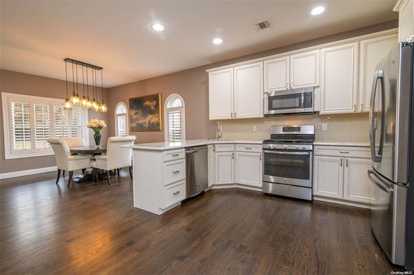 Dining room, Interior, Kitchen, Pendant Lights, Recessed Lighting, Stainless Steel Appliances, Wood Texture Flooring