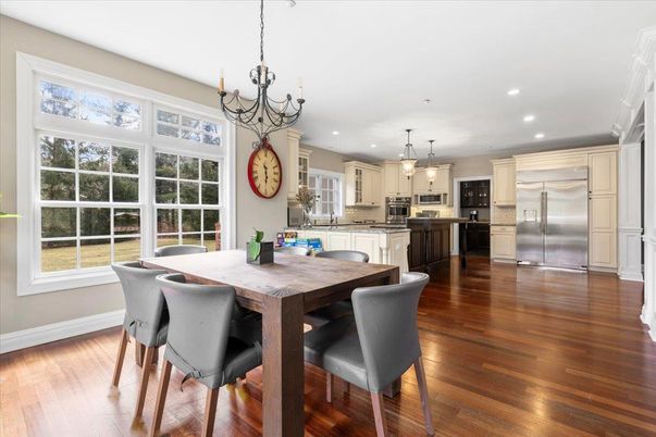 Chandelier, Dining room, Interior, Kitchen, Pendant Lights, Recessed Lighting, Stainless Steel Appliances, Wood Texture Flooring