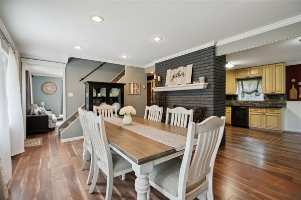 Dining room, Fireplace, Interior, Recessed Lighting, Stone Walls, Wood Texture Flooring
