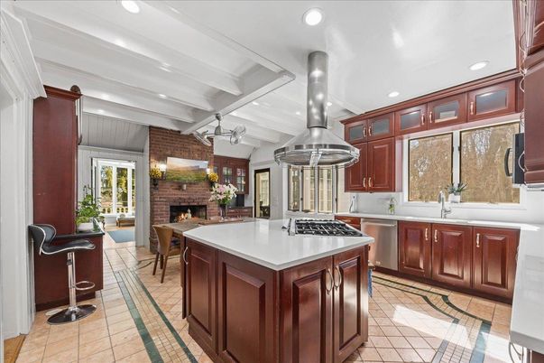 Fireplace, Interior, Kitchen, Recessed Lighting, Stainless Steel Appliances, Stone Walls
