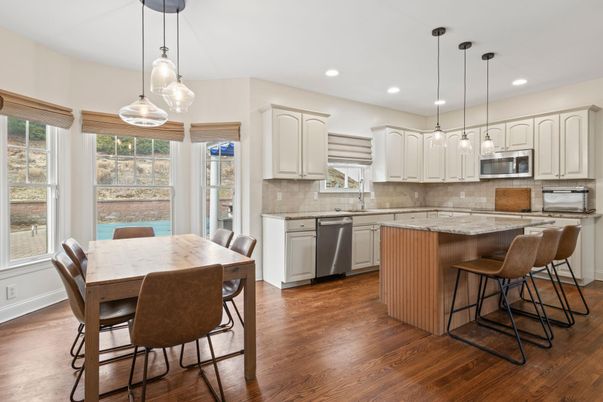 Dining room, Interior, Kitchen, Pendant Lights, Recessed Lighting, Stainless Steel Appliances, Wood Texture Flooring