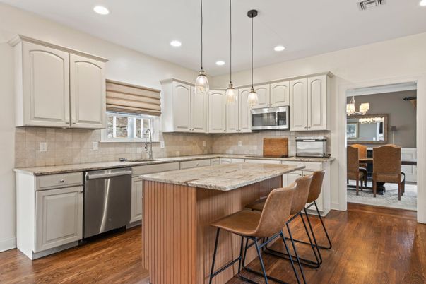 Dining room, Interior, Kitchen, Pendant Lights, Recessed Lighting, Stainless Steel Appliances, Wood Texture Flooring