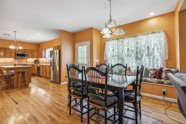 Dining room, Interior, Kitchen, Pendant Lights, Recessed Lighting, Stainless Steel Appliances, Wood Texture Flooring