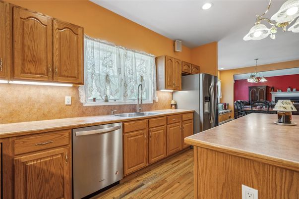 Chandelier, Dining room, Interior, Kitchen, Recessed Lighting, Stainless Steel Appliances, Wood Texture Flooring