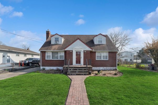 Exterior, Facade, Brick Facade, Cape Cod