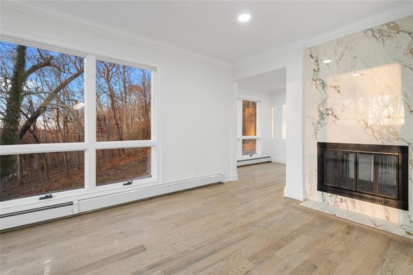 Empty room, Fireplace, Interior, Marble Walls, Recessed Lighting, Wood Texture Flooring