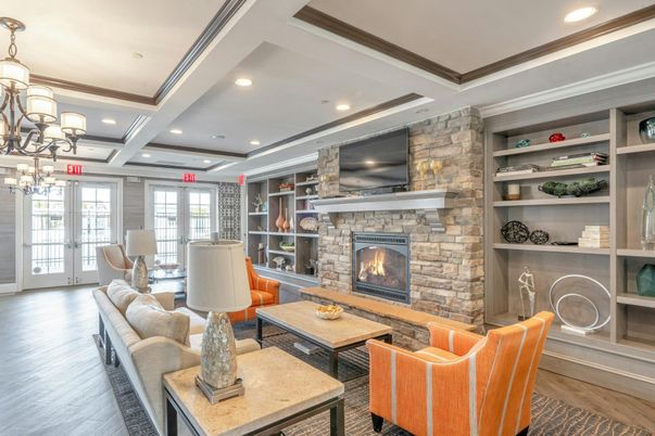 Chandelier, Fireplace, Interior, Living room, Recessed Lighting, Stone Walls, Wood Texture Flooring