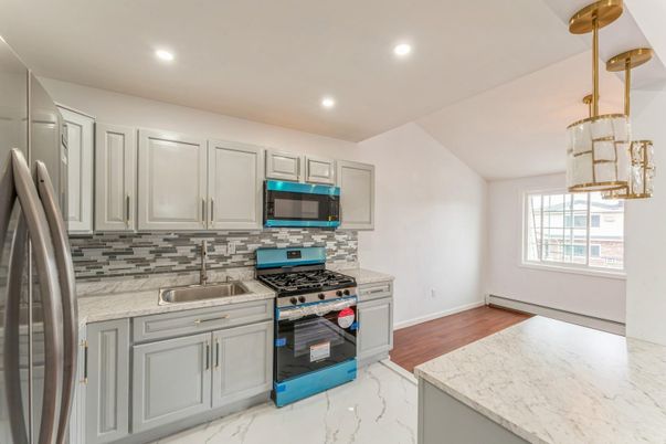 Interior, Kitchen, Marble, Recessed Lighting, Stainless Steel Appliances, Wood Texture Flooring