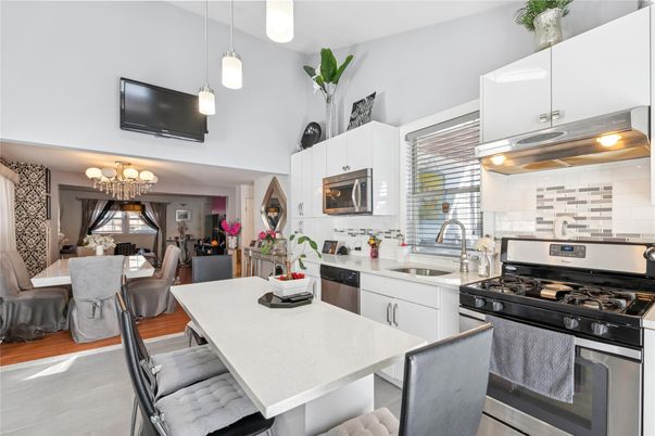 Chandelier, Dining room, Interior, Kitchen, Pendant Lights, Stainless Steel Appliances, Wood Texture Flooring