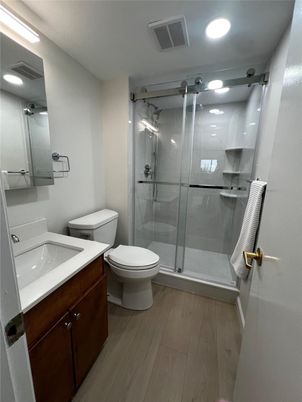 Bathroom, Glass Shower, Interior, Recessed Lighting, Wood Texture Flooring