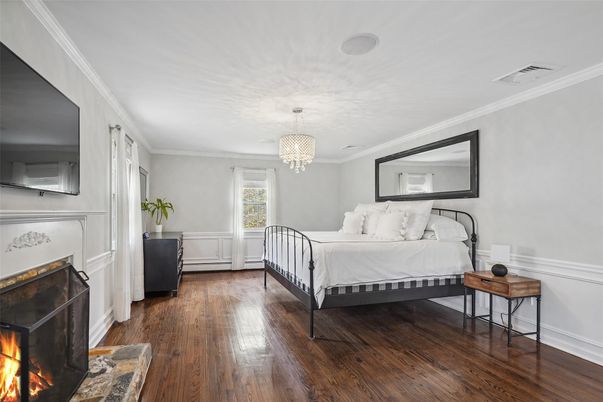 Bedroom, Chandelier, Fireplace, Interior, Wood Texture Flooring
