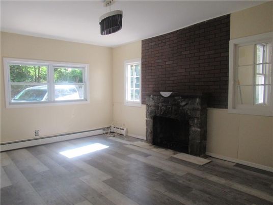 Empty room, Fireplace, Interior, Pendant Lights, Stone Walls, Wood Texture Flooring