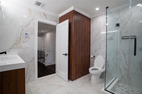 Bathroom, Glass Shower, Interior, Marble, Marble Walls, Recessed Lighting, Wood Texture Flooring