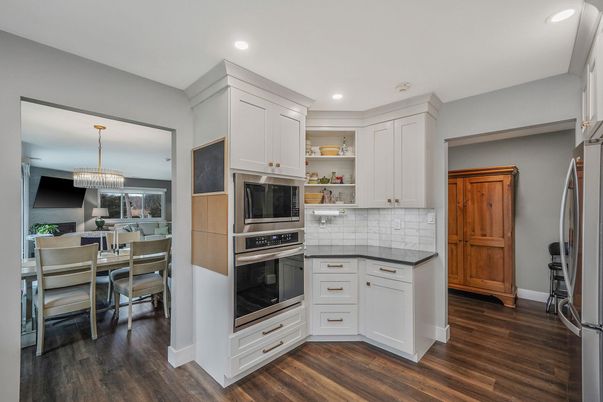 Chandelier, Dining room, Interior, Kitchen, Recessed Lighting, Stainless Steel Appliances, Wood Texture Flooring