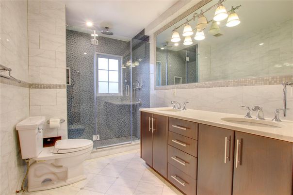 Bathroom, Dual Sink Vanities, Glass Shower, Interior, Marble, Marble Walls, Recessed Lighting