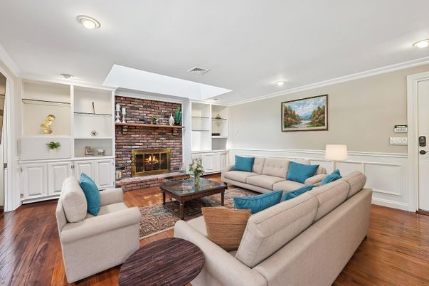 Fireplace, Interior, Living room, Recessed Lighting, Stone Walls, Wood Texture Flooring