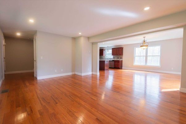 Empty room, Interior, Kitchen, Pendant Lights, Recessed Lighting, Stainless Steel Appliances, Wood Texture Flooring