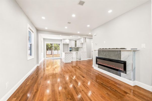 Empty room, Fireplace, Interior, Kitchen, Recessed Lighting, Wood Texture Flooring