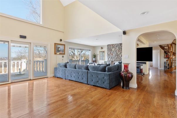 Fireplace, Interior, Living room, Recessed Lighting, Stone Walls, Wood Texture Flooring