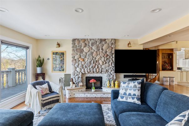 Fireplace, Interior, Living room, Recessed Lighting, Stone Walls, Wood Texture Flooring