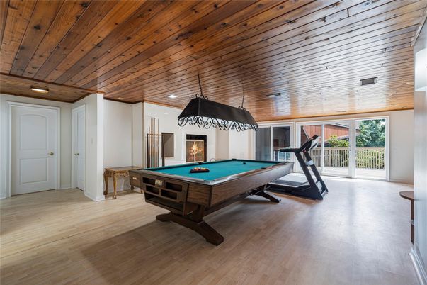 Billiard Table, Fireplace, Fitness Equipment, Game Room, Interior, Recessed Lighting, Wooden Ceilings, Wood Texture Flooring