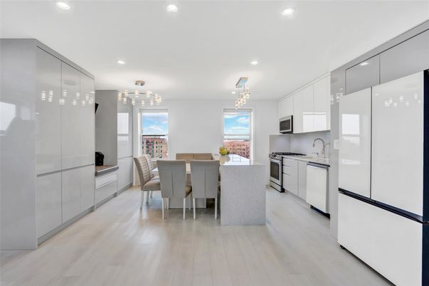 Chandelier, Dining room, Interior, Kitchen, Pendant Lights, Recessed Lighting, Stainless Steel Appliances, Wood Texture Flooring