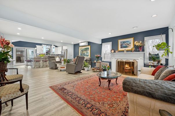 Dining room, Fireplace, Interior, Living room, Recessed Lighting, Wood Texture Flooring